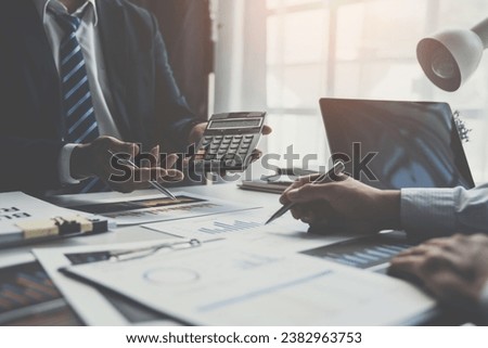 Asian business advisory meeting To analyze and plan the situation in financial reports. Calculate the company's budget in the conference room. investment consultant Finance and accounting concepts. Royalty-Free Stock Photo #2382963753