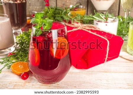 Set of different Christmas and winter drinks. An assortment of Christmas cocktails, hot and cold beverages, in cozy wooden home background with Xmas decor