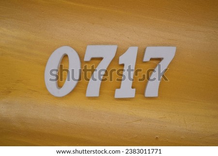 The golden yellow painted wood panel for the background, number 0717, is made from white painted wood.