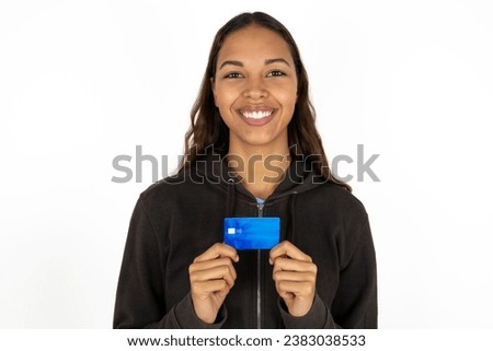 Photo of beautiful dark haired woman positive smile hold credit card income salary