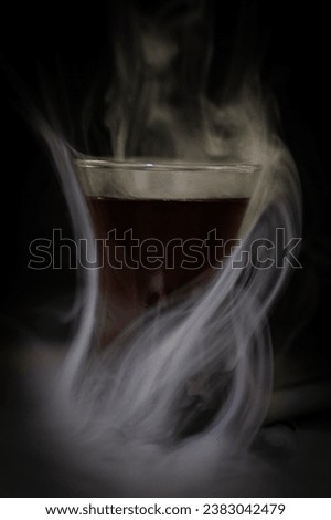 Smoked tea cup in a lightbox 