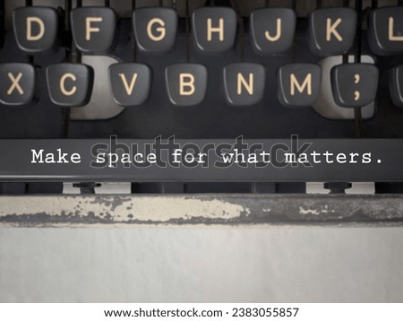 Motivational and inspirational wording. MAKE SPACE FOR WHAT MATTERS written on a typewriter spacebar. With blurred styled background.