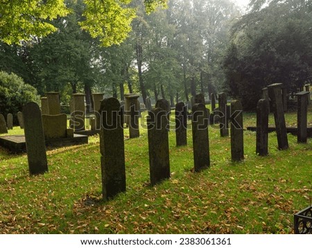 Silhouette of graves at a cemetery in the village Flinsterwolde, Groningen, the Netherlands