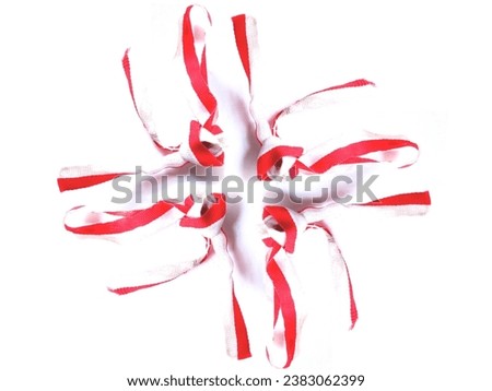 This is a photo of a red and white ribbon 