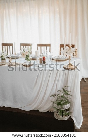 Flower decoration for celebrations. Decoration of tables and chairs. Rustic decoration.

