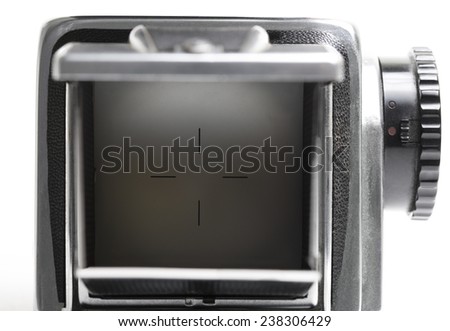 Macro picture of a twin-lens reflex viewfinder. White background.