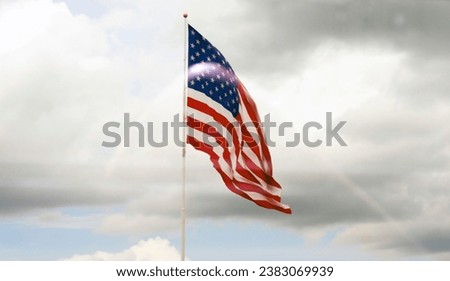 The reflex of American flag in window