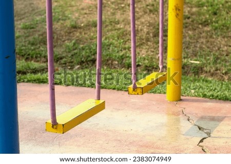 yellow swing in the playground