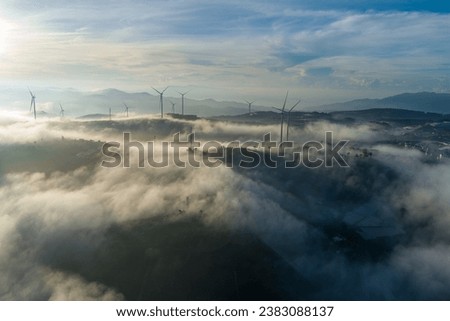 Black Windmill.Misty morning by the mistic lake
