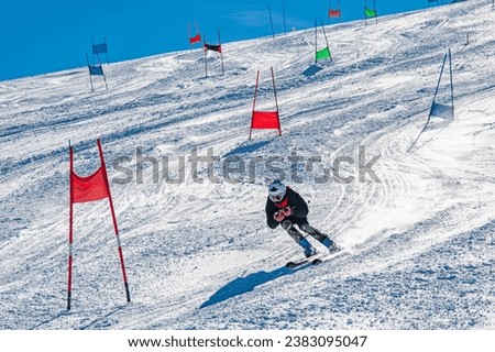 Skier on a slope in the italian alps Royalty-Free Stock Photo #2383095047