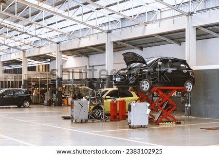 car repair and maintenance services tailored to the automotive industry. Experience craftsmanship and reliable service at our garage. Royalty-Free Stock Photo #2383102925