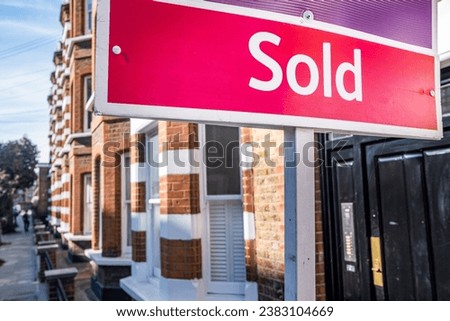 Estate agent Sold sign on residential street south west London