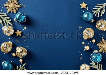Christmas card. Frame borders made of gold balls, decorations, fir branches on dark blue background. Luxury style. Royalty-Free Stock Photo #2383120595