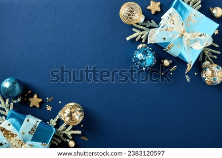Christmas blue background with gift boxes and decorations in luxury style. Xmas greeting card template.