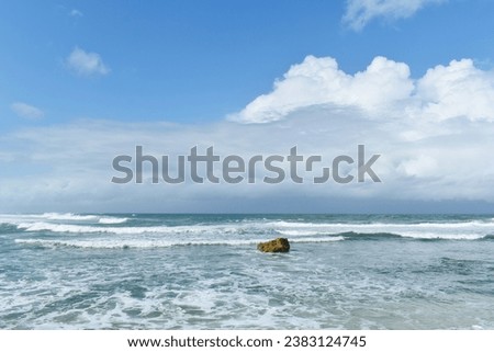 Summer view of Ngandong beach in Yogyakarta, Indonesia. Blue sea with blue sky.
