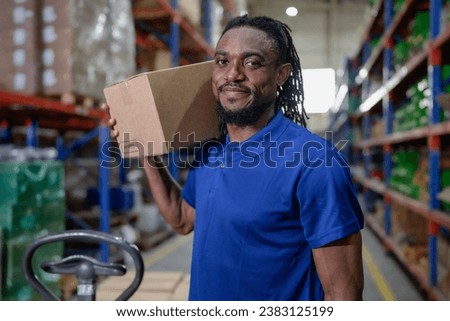 Portrait of male supervisor standing one person at storage shelf in warehouse looking at camera. Confident multiracial logistic staff employee working with stock box good delivering in storehouse.