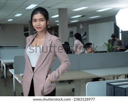 businesswoman female lady woman adult young pretty beautiful look at camera professional employee entrepreneur boss manager copy space office organization company career business portrait work job 