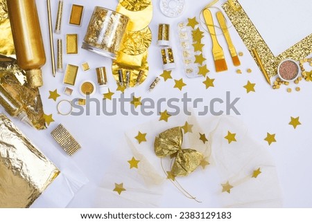 Gilding accessories in golden color for master craftsman.  Still life of golden color accessories. Gold plate art and gilding.