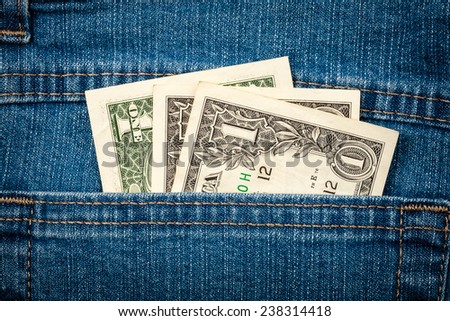 Just three american dollars in jeans back pocket  