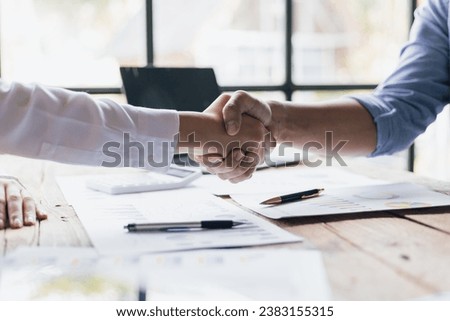 Business people shaking hands in business partnership meeting. Royalty-Free Stock Photo #2383155315