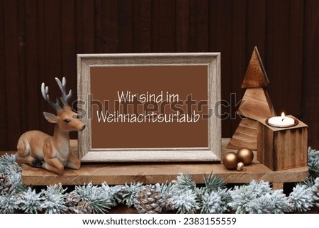 Frame with Christmas decoration,German inscription means we are on Christmas vacation.