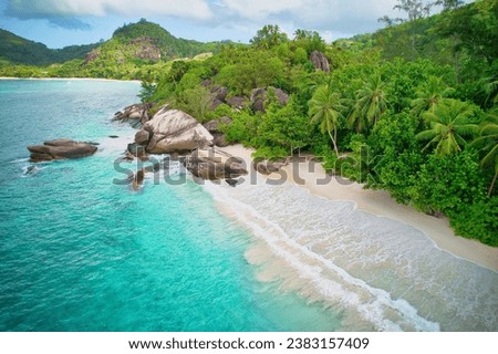 Drone of baie lazare beach, huge granite stones, white sandy beach, turquoise water, coconut palm trees, sunny day, Mahe Seychelles 4 Royalty-Free Stock Photo #2383157409