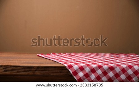 top view with red empty kitchen napkin isolated on table background. Folded cloth for mockup with copy space, Flat lay. Minimal style. High quality photo Royalty-Free Stock Photo #2383158735