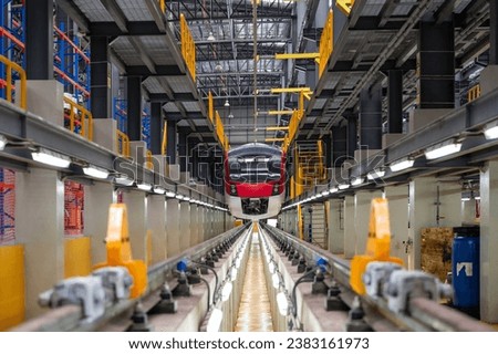 Red Electric train parked in the depot Royalty-Free Stock Photo #2383161973
