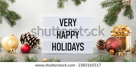 Lightbox with text Merry xmas and happy new year and christmas decor on the table against white background. Front view banner