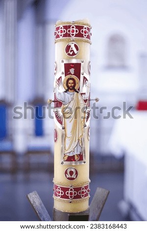 paschal candle - religious symbol with image of Jesus Christ