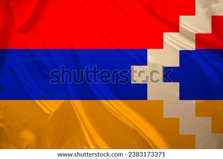 colored national flag Nagorno-Karabakh sovereignty and independence as nation on textured fabric, concept unique cultural and political identity, tourism, emigration, economy and politics