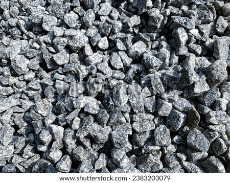 Natural stone crumb. Stone background from natural stone chips: jasper, serpentine, granite. Stone chips for landscaping, garden paths, flower arrangement. Texture of small stones background Royalty-Free Stock Photo #2383203079