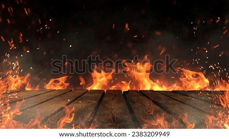 Wooden table and fire with sparks and smoke, concept. Grill, burning fire and free copy space for design
