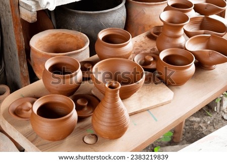 Exhibition of pottery. Pottery. Set of clay pots. The ancient art of making pottery..
