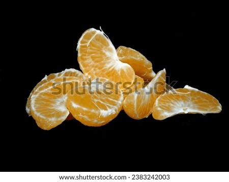 Tangerines on black background - closeup
