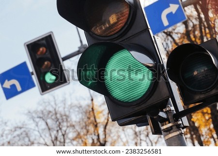 Green traffic light signal. Left and right intersection. Permission to drive. Smart traffic light. City crossing with semaphore.