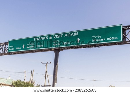 MOYALE, ETHIOPIA - FEBRUARY 8, 2020: Traffic sign at the Moyale border post directing into Kenya