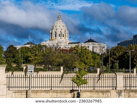 Capitol building in the state of Minnesota in Saint Paul, MN with one way sign pointing to right suggesting republican swing