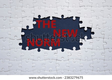 The new norm symbol. Concept words The new norm on white puzzle. Beautiful dark blue background. Business and The new norm concept. Copy space. Royalty-Free Stock Photo #2383279675