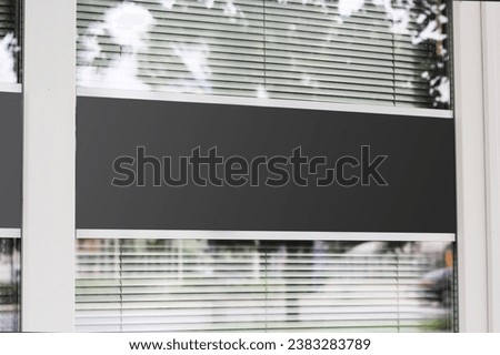 Large shop window with urban background reflection mockup template. Empty office window for business logo mock up template.
