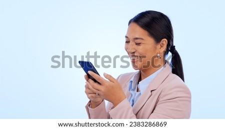 Business, woman and phone in studio for search, networking and planning with happy expression on blue background. Person, smartphone or technology for scrolling on social media or website on mock up
