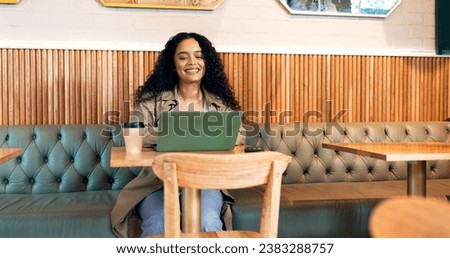 Happy woman in cafe, typing on laptop and remote work, reading email or writing blog, article or search on technology. Computer, freelancer or copywriting in coffee shop, store or restaurant at table