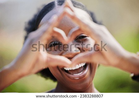 Happy black woman, portrait and face with heart hands for love, care or healthy wellness in nature. African female person smile with like emoji, symbol or icon and hand gesture for romance outdoors