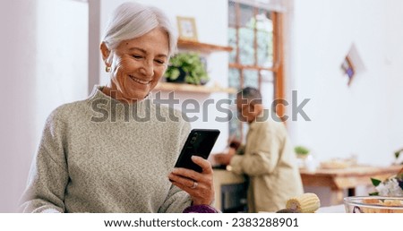 Senior woman, smile and phone with reading, texting and communication on web, app and typing in home. Elderly lady, drink and happy in kitchen with smartphone, social network and thinking in house