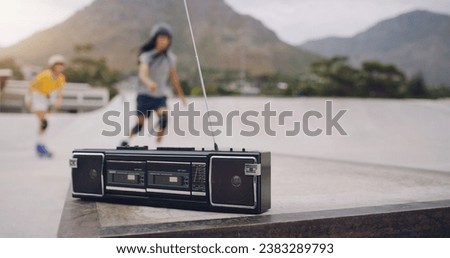 Skate park, music and a retro radio outdoor for urban skating with people in blurred background. Freedom, cassette tape and energy for balance sports, action and training for fitness with audio sound