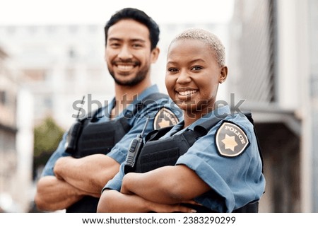 Happy police, team and arms crossed in confidence for city protection, law enforcement or crime. Portrait of man and woman officer standing ready for justice, security or teamwork in an urban town Royalty-Free Stock Photo #2383290299