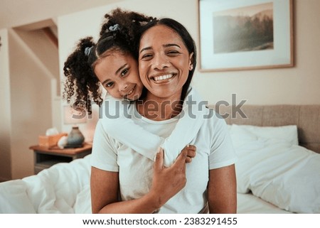 Portrait, mother and girl with on a bed, hug and happiness with quality time, love and weekend. Family, mama or female child with joy, home or fun in a bedroom, face and embrace with a smile or relax