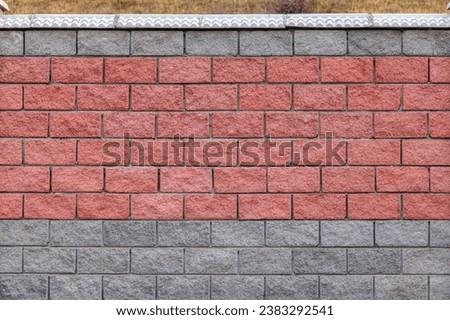 Fence made of slag bricks in a mountainous area
