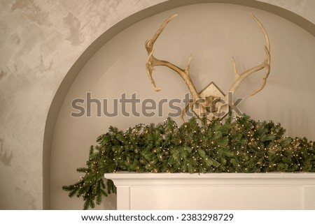 new year cozy home interior with Christmas tree and garlands 