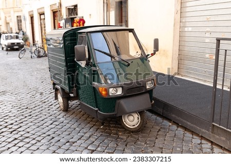 Auto rickshaw or tuk-tuk in a street, transportation concept Royalty-Free Stock Photo #2383307215